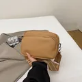 Brown litchi grain crossbody bag with dual zippers and striped wide shoulder strap - Khaki