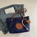 Dark blue nylon tote bag with brown leather straps and a cute plush bear pendant - Large / Dark Blue Large With Charm
