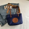 Dark blue nylon tote bag with brown leather patch and adjustable crossbody strap - Small / Dark Blue Small No Charm