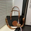 Black tote bag with brown leather handles and adjustable strap with a plush bear charm - Small / Black Small With Charm