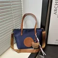 Dark blue nylon tote bag with brown straps and a cute plush bear charm accessory - Small / Dark Blue Small With Charm