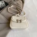 Chic cream white crossbody bag with silver bow ornament and quilted flap edges - White