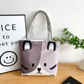 Japanese style canvas tote bag featuring a cute purple cartoon cat face and grey handles - Gray