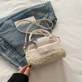 Chic cream white lace messenger bag with bow detail on denim background - Off White