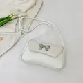 Chic beige underarm bag with crocodile embossed pattern and silver metal bow detail - White