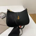 Retro black leather underarm bag for women with vintage gold buckle and slim strap - Black
