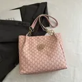 Pink tote bag with dark pink M pattern and golden logo for stylish commuters - Pink