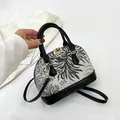 Vintage shell-shaped handbag with black and white floral canvas and leather trim - Black