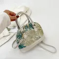 Shell shaped handbag with green palm embroidery and cream leather details - Green