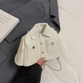 Chic off-white jacket-style crossbody bag with metallic chain and collar detail - Beige