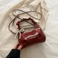 Fashionable dark red pleated shoulder bag with pearl bow charm and metal chain strap - With Pendant / Red