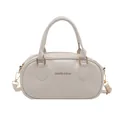 Minimalistische beige bowlingtas voor dames met handvatten en verstelbare schouderband - Beige