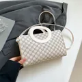 Beige monogram top handle bag with ring handles and slender crossbody strap - White