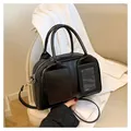 Chic black PU leather Boston bag with external pockets and slim shoulder strap - Black