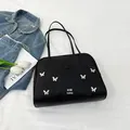 Modische schwarze Tragetasche mit silbernem Schmetterling und feinen Griffen - Schwarz