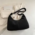 Minimalist black crescent moon tote bag with wide strap and sleek vintage texture - No Pendant / Black