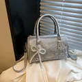 Silver snakeskin texture Boston bag with pearl bow charm and crossbody strap - With Pendant / Silver