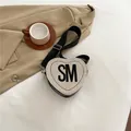 Chic cream heart-shaped woven crossbody bag with black SM letter embroidery and wide strap - Black