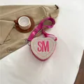 Pink heart-shaped crossbody bag with woven straw texture and SM letter embroidery - Rose Red