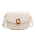 Minimalist cream white saddle crossbody bag with a polished golden U-shaped metal buckle - White