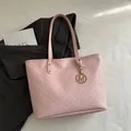 Pale pink patterned tote bag with M-letter monogram print and golden metal charm - Pink