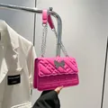 Hot pink quilted crossbody bag with silver butterfly charm and chain strap detail - Rose Red