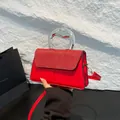 Fashionable red crossbody handbag with red glitter sequins and silver metallic handle - Red