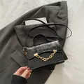 Chic black crocodile embossed box bag with stylish gold chain and crossbody strap - Black