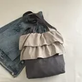 Borsa tote con volant color tortora e grigio scuro in finta pelle scamosciata - grigio scuro