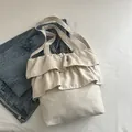 Elegante borsa tote in tela beige con volant a balze per donna in stile balletcore - Bianco