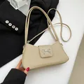 Bolso baguette beige tejido con un lazo de metal plateado y correas dobles finas - Caqui