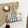 Klassieke zwart-witte tweed shopper met witte lederen hengsels en decoratief lintaccent - Wit
