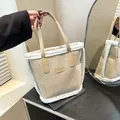Beige faux suede bucket bag with white faux fur trim and long handle for winter fashion - No Pendant / Khaki