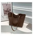 Detail of dark brown PU leather tote bag featuring a practical front pocket with snap button - Brown