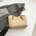 Minimalist beige tote bag with dark brown handles and adjustable gold buckles - Khaki