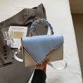 Light blue and cream color-block handbag with twisted handle and gold hardware - Blue