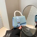 Light blue mini square handbag with glitter flap, pearl handle, and gold chain strap - Green