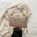 Elegant pink jacquard handbag with butterfly embroidery and rhinestone handle - Pink