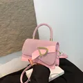 Pink rhinestone handbag with golden D-buckle and elegant bow for a luxury look - Pink