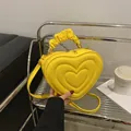 Yellow heart-shaped crossbody bag with multi-layer heart embossing and ruched handle - Yellow