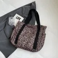 Leopard print canvas tote bag with black straps and snap closure for daily use - Purple