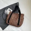 Chic leopard print canvas tote bag with black webbing handles and side pockets - Brown