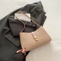 Elegant beige crescent shoulder bag with golden metallic clasp for women - Khaki