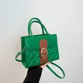 Green leather tote bag with geometric quilting and large gold horseshoe buckle detail - Green