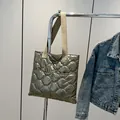 Quilted tote bag in champagne metallic finish with cream woven handles and retro style - Gold