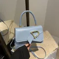 Light blue faux leather square handbag with golden D-buckle and bow detail - Blue