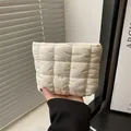Minimalist white quilted checkered makeup bag with soft textured bubble fabric finish - White