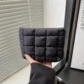 Sleek black padded checkered quilted handbag with premium shiny nylon finish - Black