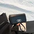 Minimalist black leather crossbody bag with iconic silver Gancini buckle and leather strap - Black