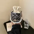 Leopard print bucket bag with large pearl handle and gold chain strap in boxy style - Gray